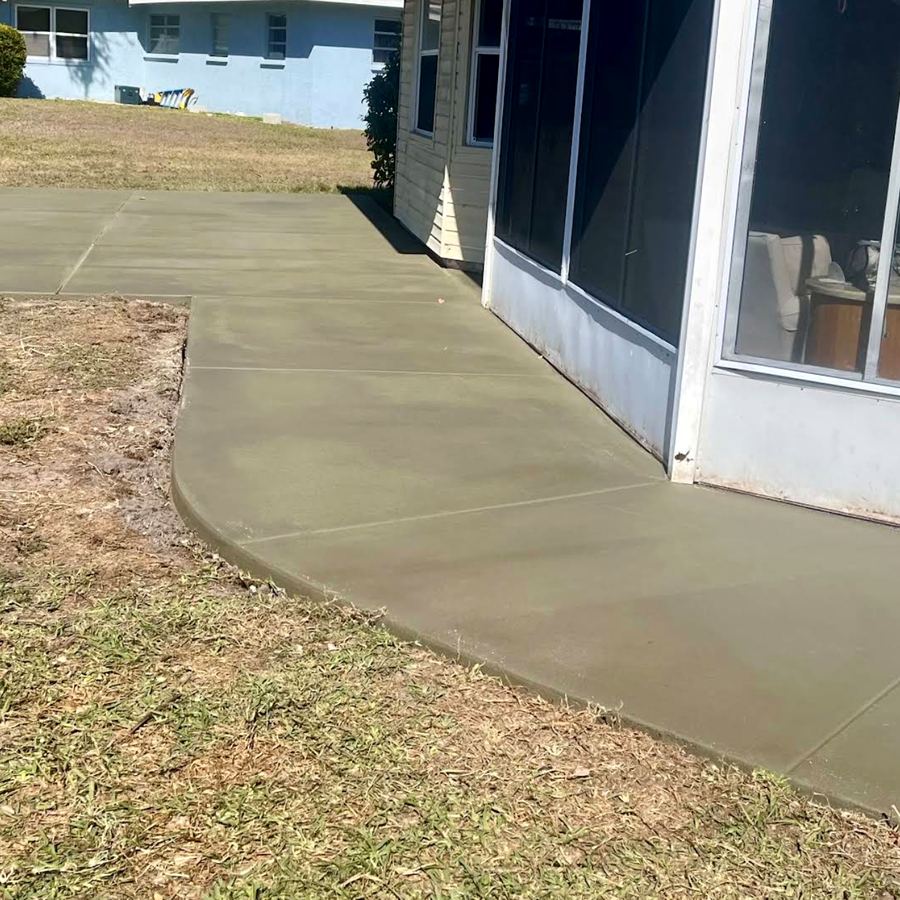 Patio and walkway around screened porch